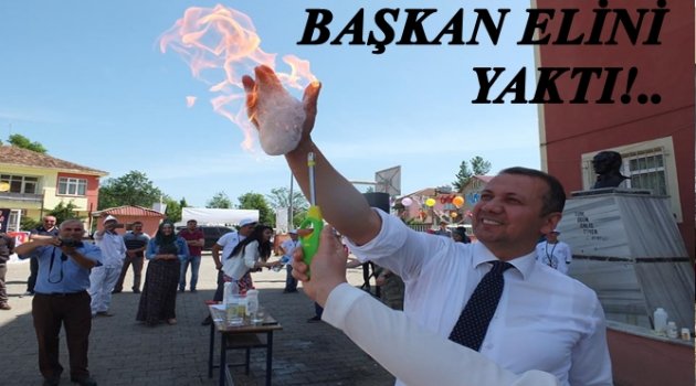 BAŞKANIN ELİNİN YANMASINI MERAKLA İZLEDİLER